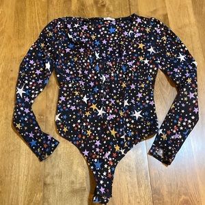XS Free People bodysuit with beautiful star pattern. Thong closure with snaps.